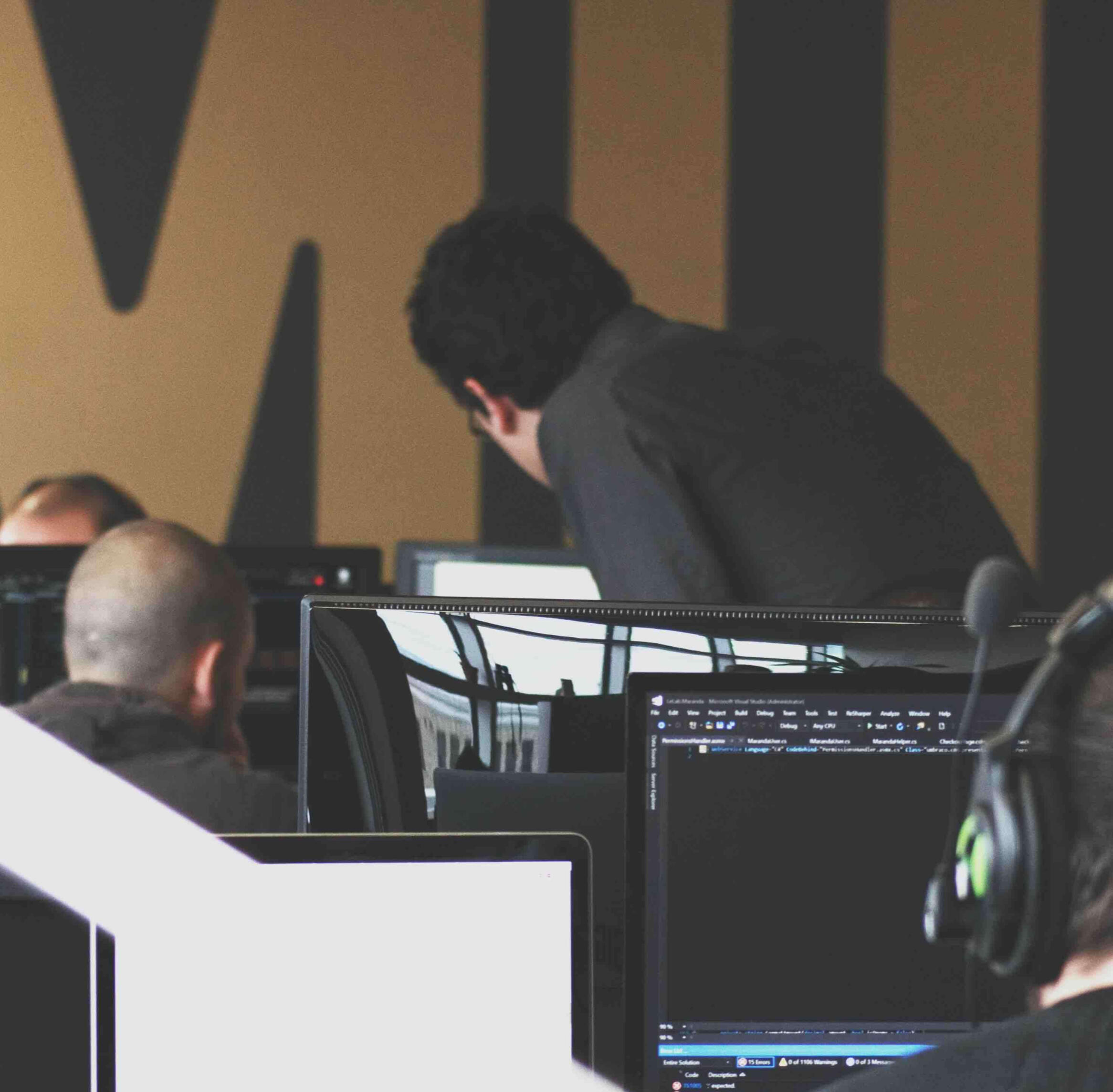 Two people reviewing a document on a computer.